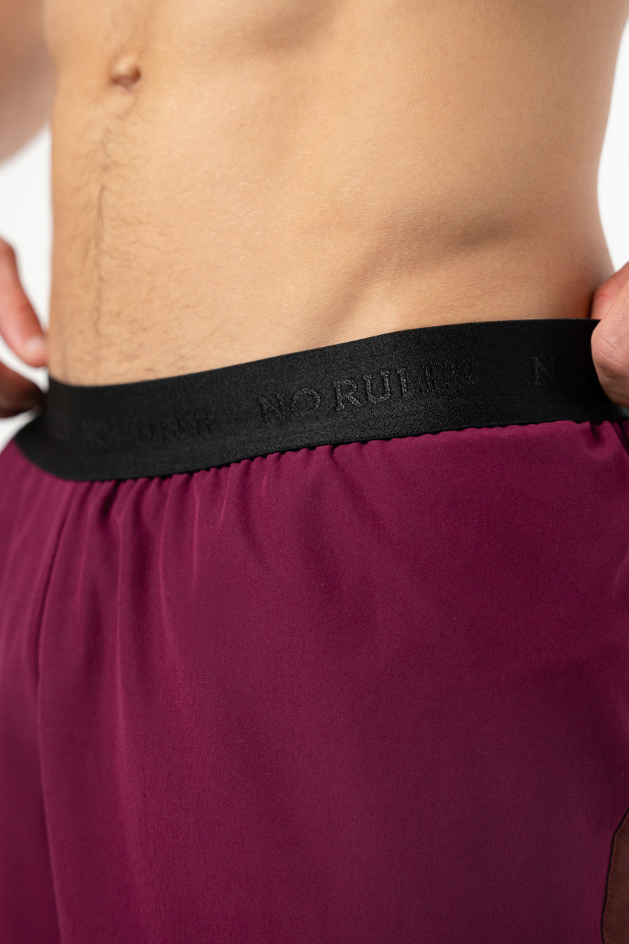 Pantaloneta Running Pro Retro Berenjena